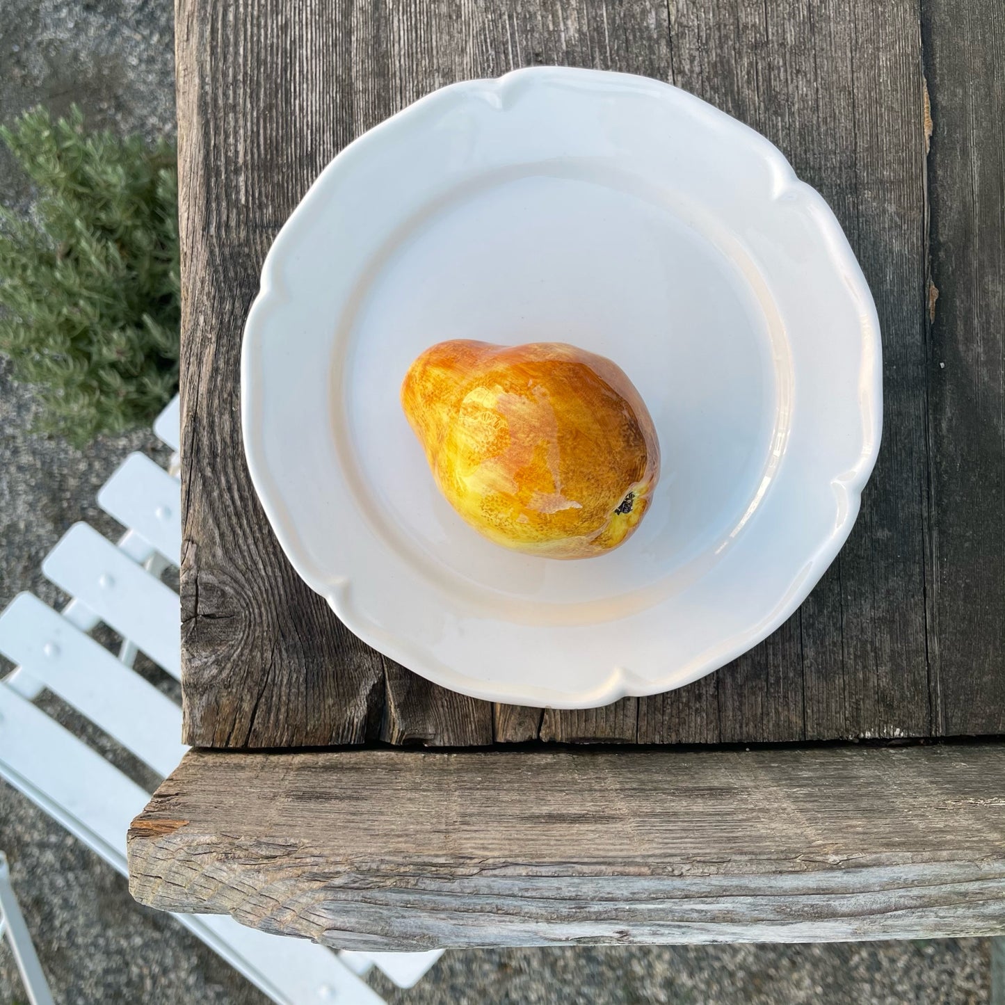 Porcelain Bosc Pear on a Fluted Plate